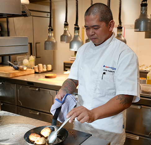 chef justin cooking in the kitchen at west end social