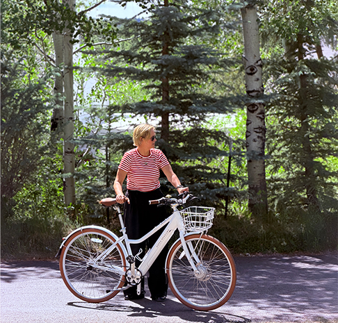woman rides ebike on the trail