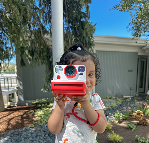Child with Polaroid Camera