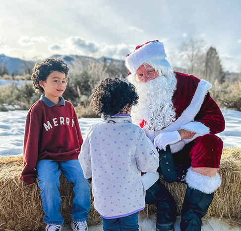 Two children visit with Santa