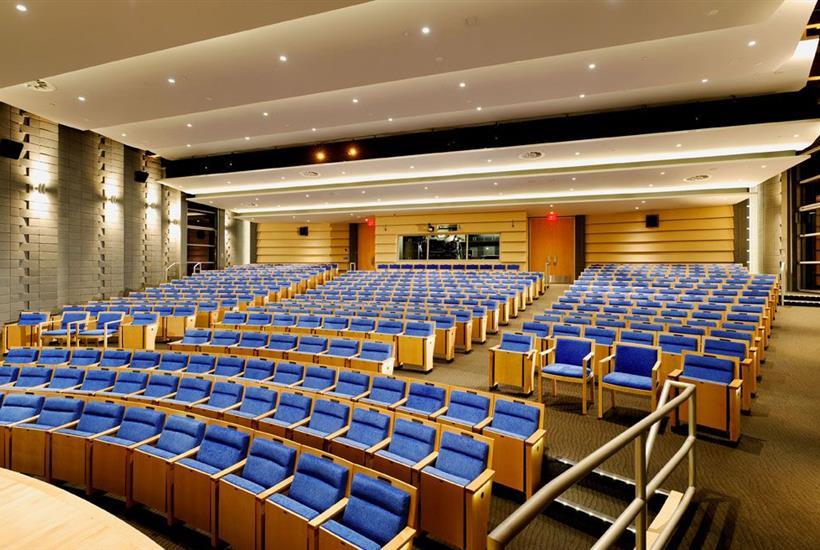 Empty movie auditorium with rows of comfortable seats