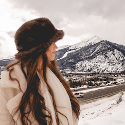 woman next to the Aspen Mountain