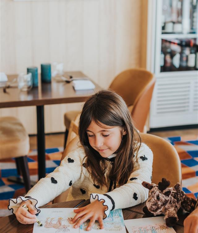 woman sitting at west end social window