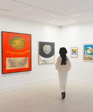 A woman looking at artwork