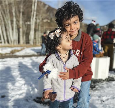 brother and sister in the snow