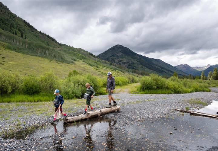 Kids crossing a river