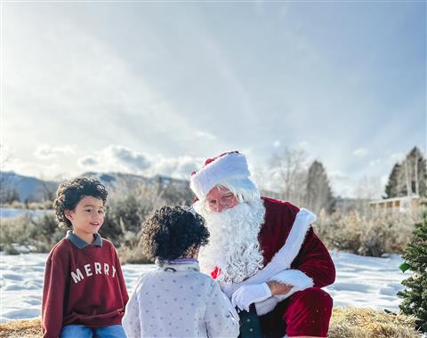 Small girl throwing snow in Anderson Park